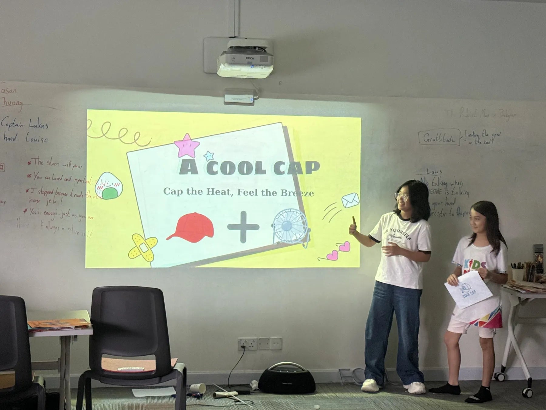 Two campers presenting their invention
