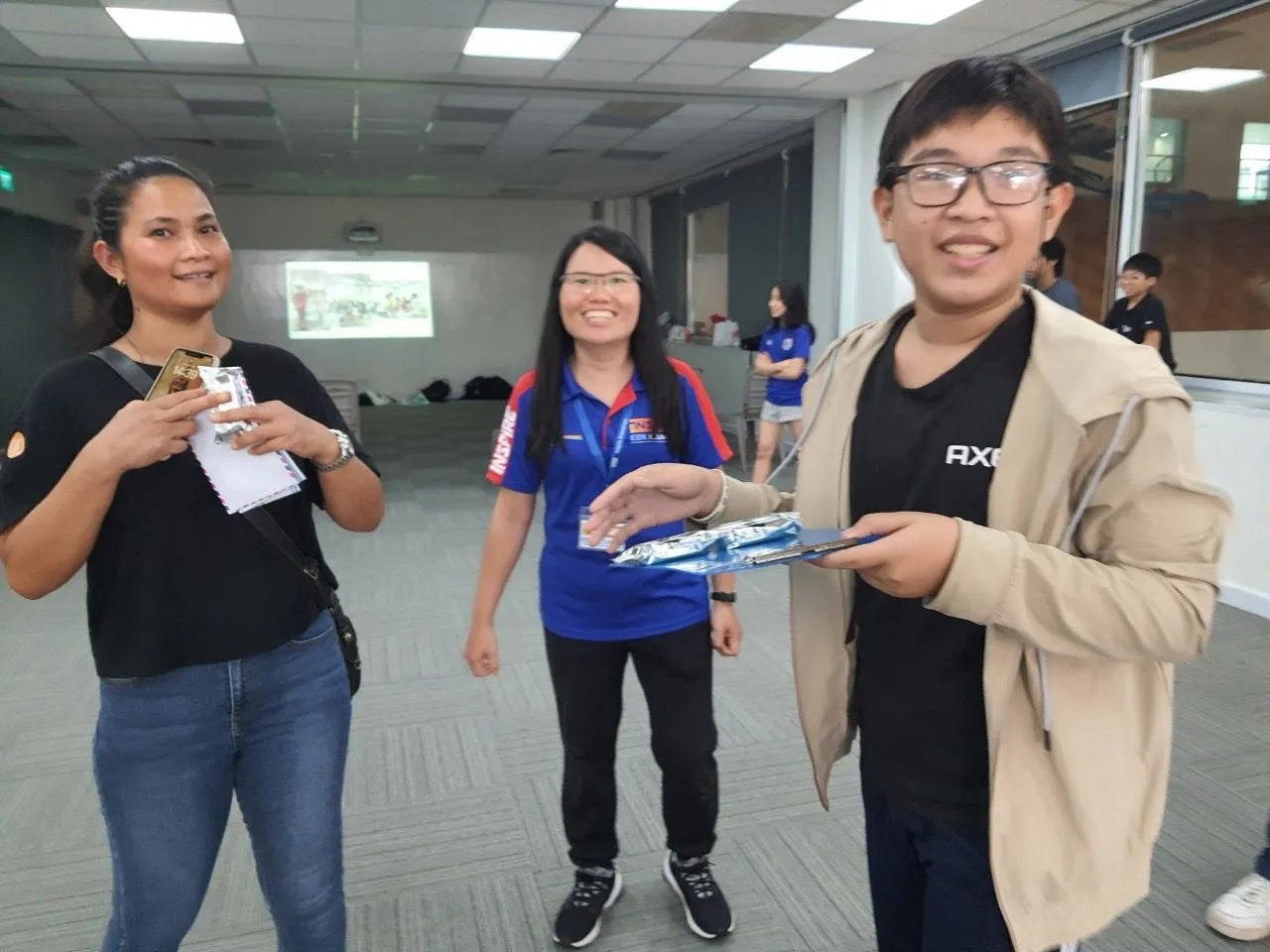 A Group Leader with a parent and camper